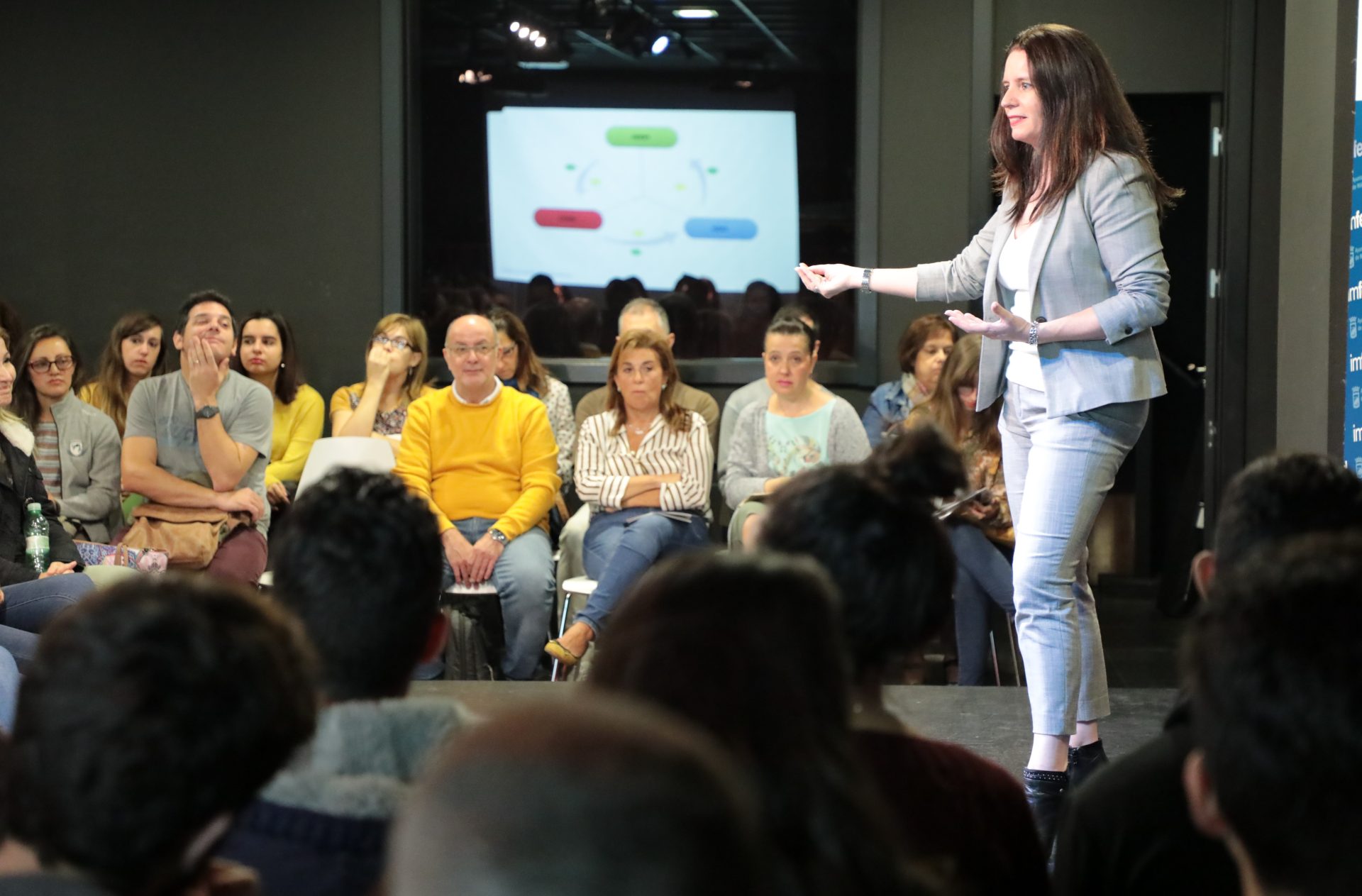 Four women collaborate in a modern office space, fostering teamwork and discussion.