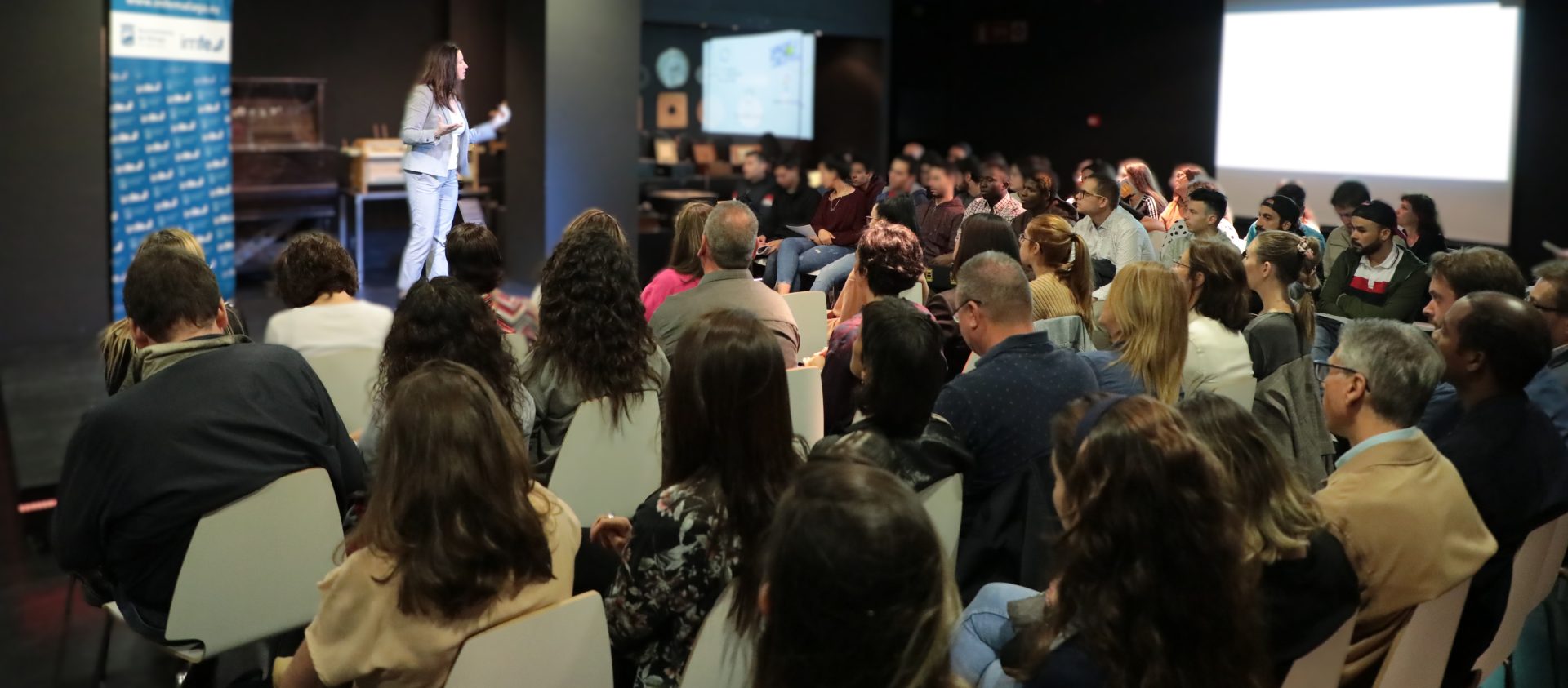 A group therapy session taking place indoors with an attentive counselor guiding the discussion.